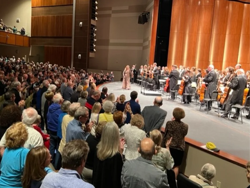 A large crowd of people in an auditorium.