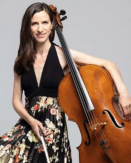 A woman holding a cello and posing for the camera.